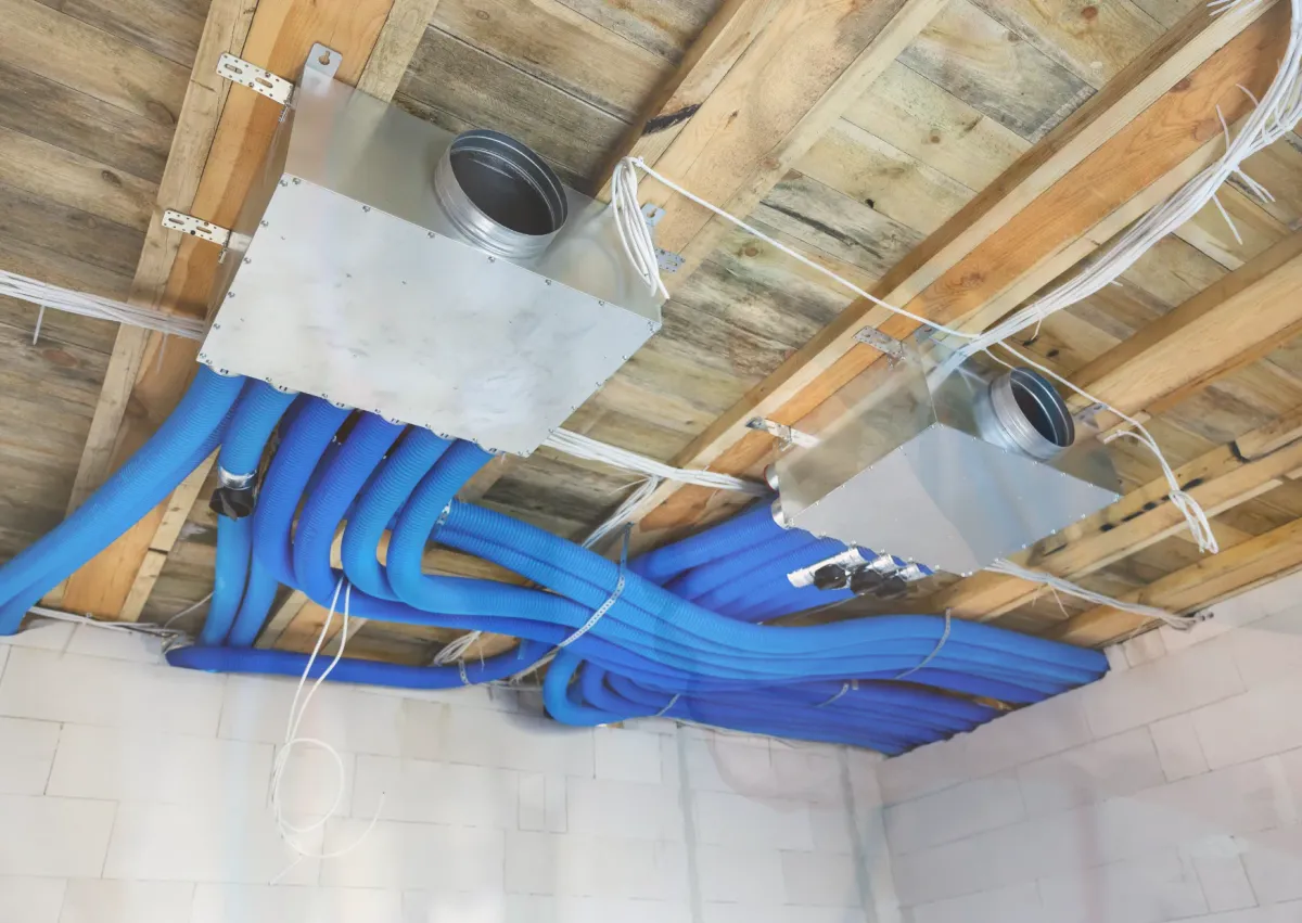 Ventilation distribution boxes with insulated flexible ducts installed along the ceiling for whole-home air control